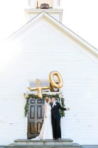 Felt Mansion Wedding with gold XO balloons.