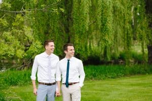 Two grooms on their wedding day at a backyard wedding in Michigan.