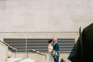 A wedding portrait at the GRAM in Grand Rapids, MI with modern lines and shadows.