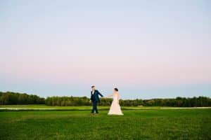 A bride and groom photo at their wedding in Traverse City at sunset.