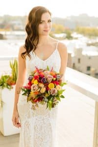 A bride portrait at New Hotel Mertens on the rooftop with a view of Grand Rapids, MI.