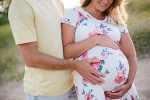 A beach maternity session at sunset at the Holland State Park in Michigan.