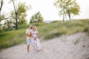 A beach maternity session at sunset at the Holland State Park in Michigan.