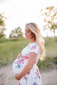 A beach maternity session at sunset at the Holland State Park in Michigan.