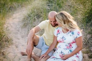 A beach maternity session at sunset at the Holland State Park in Michigan.