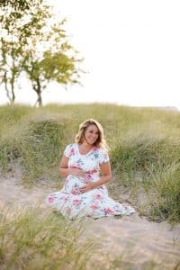 A beach maternity session at sunset at the Holland State Park in Michigan.