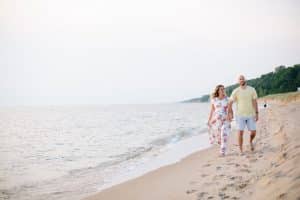 A beach maternity session at sunset at the Holland State Park in Michigan.