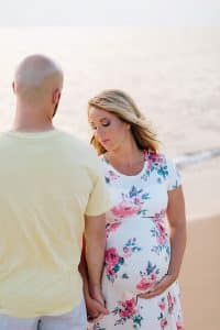 A beach maternity session at sunset at the Holland State Park in Michigan.