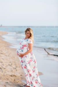 A beach maternity session at sunset at the Holland State Park in Michigan.