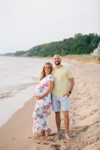A beach maternity session at sunset at the Holland State Park in Michigan.