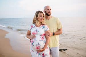 A beach maternity session at sunset at the Holland State Park in Michigan.