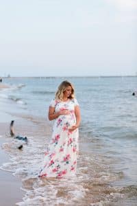 A beach maternity session at sunset at the Holland State Park in Michigan.