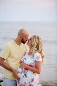 A beach maternity session at sunset at the Holland State Park in Michigan.