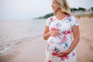 A floral maternity dress from Wren and Ivory photographed in Holland Michigan.