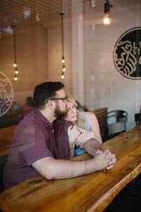 A lifestyle engagement session at Lyon Street Cafe in Grand Rapids, Michigan.