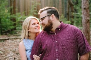 A romantic engagement session in Grand Haven Michigan at Rosy Mounds nature trails with a beautiful couple and beautiful sunlight.