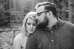 A romantic engagement session in Grand Haven Michigan at Rosy Mounds nature trails with a beautiful couple and beautiful sunlight.