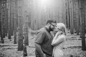 A romantic engagement session in Grand Haven Michigan at Rosy Mounds nature trails with a beautiful couple and beautiful sunlight.