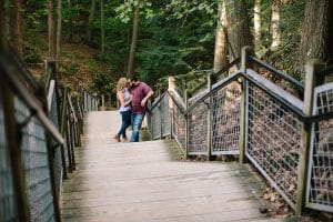 A romantic engagement session in Grand Haven Michigan at Rosy Mounds nature trails with a beautiful couple and beautiful sunlight.