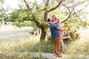 A beach engagement session in Grand Haven at Rosy Mounds.