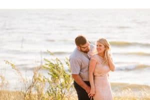 A beach engagement session in Grand Haven at Rosy Mounds.