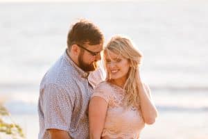 A beach engagement session in Grand Haven at Rosy Mounds.