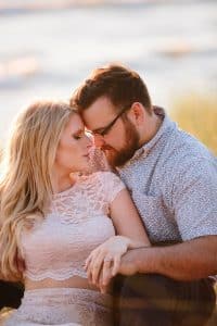 A beach engagement session in Grand Haven at Rosy Mounds.