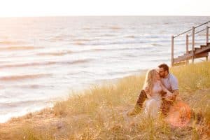 A beach engagement session in Grand Haven at Rosy Mounds.