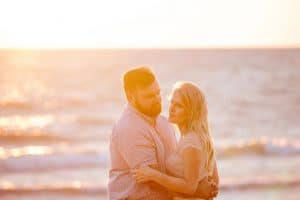 A beach engagement session in Grand Haven at Rosy Mounds.