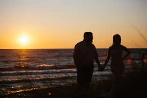 A beach engagement session in Grand Haven at Rosy Mounds.