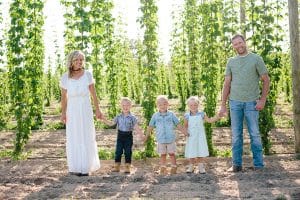 Michigan family lifestyle photography in a hop yard with the most adorable triplets. Great kids outfit ideas and a unique picture location idea.