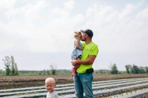 A day in the life session with toddler triplets working in the garden.