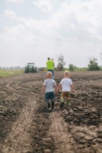 A day in the life session with toddler triplets working in the garden.