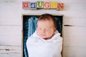 Newborn baby photos with baby letter blocks.