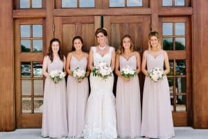 This blush pink Grand Rapids wedding was at Watermark Country Club. Florals and Design by Modern Day Floral and Events. Photography by Mae Photo Co.