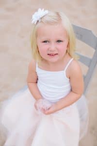 A Michigan Holland beach family engagement with a white, pink, and light blue color pallet.