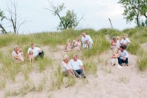 A Michigan Holland beach family engagement with a white, pink, and light blue color pallet.