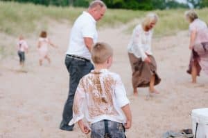 A Michigan Holland beach family engagement with a white, pink, and light blue color pallet.