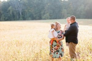 The Brock family had their Fall family pictures taken in the country in a soy bean field.