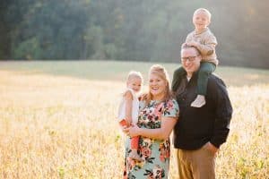 The Brock family had their Fall family pictures taken in the country in a soy bean field.