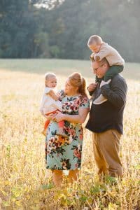 The Brock family had their Fall family pictures taken in the country in a soy bean field.