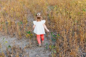 The Brock family had their Fall family pictures taken in the country in a soy bean field.