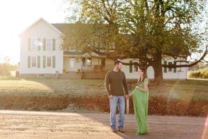 A country lifestyle maternity session right at Jen and Sean's home in Caledonia Michigan. Jen wore a beautiful green dress and their dogs even made an appearance.