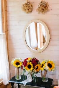 Cailly and Tyler had a rainy wedding day at Millcreek Barn in Michigan. Cailly wore a beautiful and unique wedding dress from Truvelle.