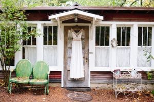 Cailly and Tyler had a rainy wedding day at Millcreek Barn in Michigan. Cailly wore a beautiful and unique wedding dress from Truvelle.