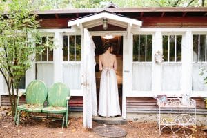 Cailly and Tyler had a rainy wedding day at Millcreek Barn in Michigan. Cailly wore a beautiful and unique wedding dress from Truvelle.