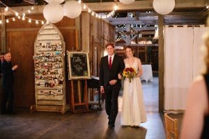 Cailly and Tyler had a rainy wedding day at Millcreek Barn in Michigan. Cailly wore a beautiful and unique wedding dress from Truvelle.