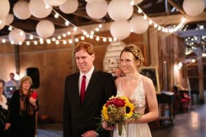 Cailly and Tyler had a rainy wedding day at Millcreek Barn in Michigan. Cailly wore a beautiful and unique wedding dress from Truvelle.