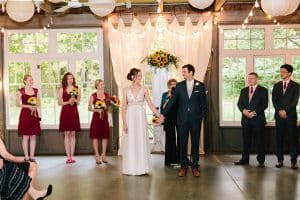 Cailly and Tyler had a rainy wedding day at Millcreek Barn in Michigan. Cailly wore a beautiful and unique wedding dress from Truvelle.