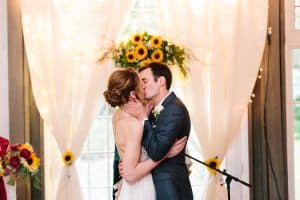 Cailly and Tyler had a rainy wedding day at Millcreek Barn in Michigan. Cailly wore a beautiful and unique wedding dress from Truvelle.